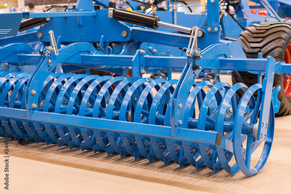 Fototapeta premium Agricultural machinery for soil cultivation. New modern models of agricultural machinery. New agricultural equipment.