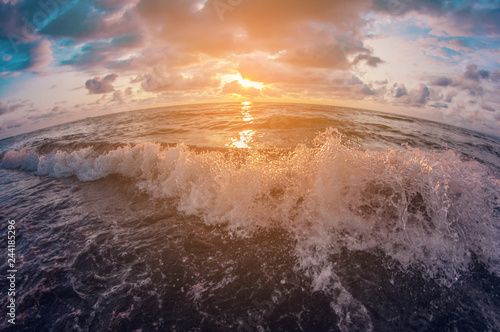 Seascape. Beautiful colorful sunset sky over the wavy sea. distortion perspective fisheye lens
