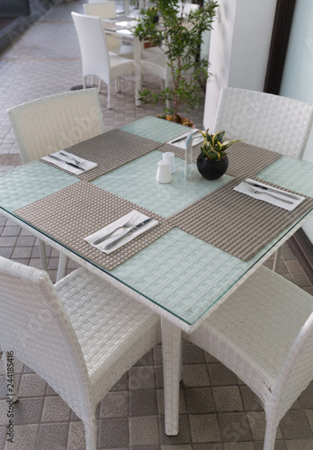 woven furniture design with breakfast covered table cutlery and napkin stylish decoration