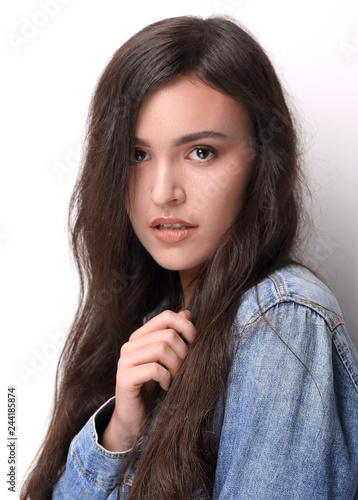 Portrait of beautiful young woman with black hair