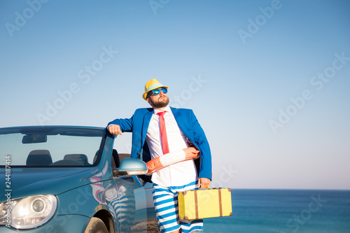Successful young businessman on a beach