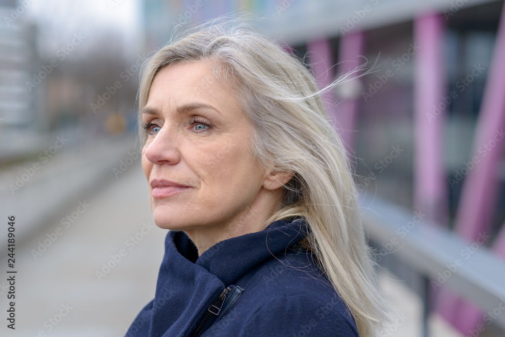 Serious woman looking intently to the side Serious woman looking intently to the side
