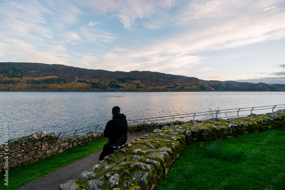 loch ness views with a man in urquhart castle