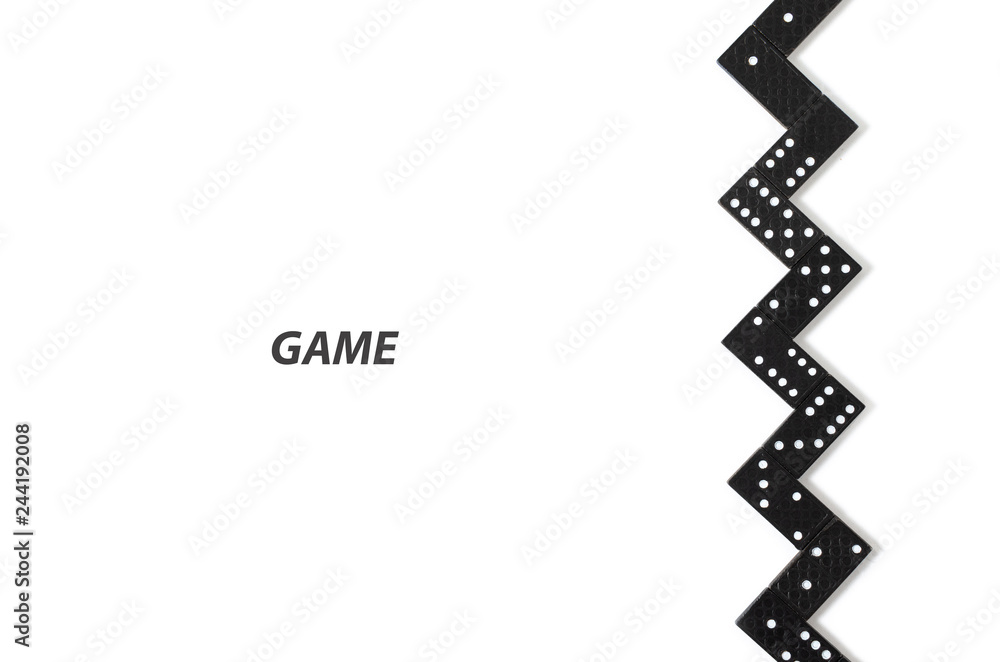 Black dominoes on white background with copy space