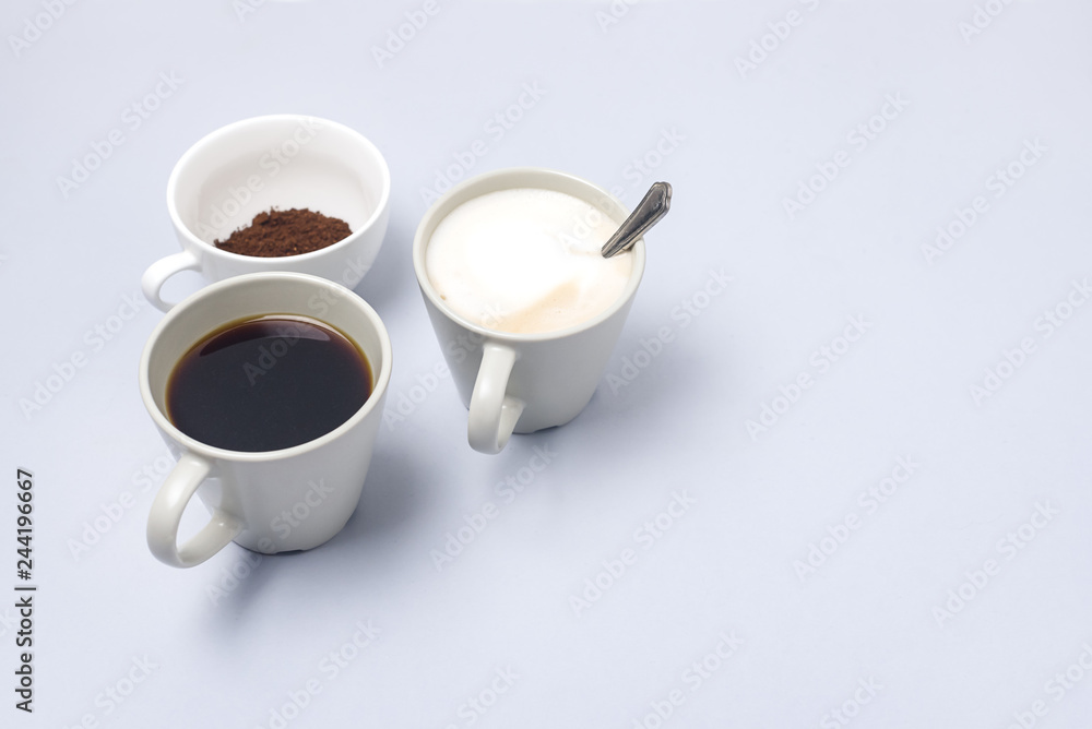 Coffee Cup Assortment Cup of Espresso Cup of Cappuchino Cup with Ground Coffee Blue Background Copy Space Coffee Cup Assortment Cup of Espresso Cup of Cappuchino Cup with Ground Coffee Blue Background Copy Space