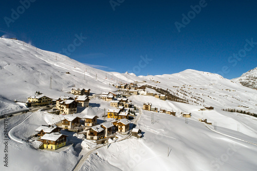 Little village of Trepalle. Valtellina
Houses covered with snow, winter season. photo