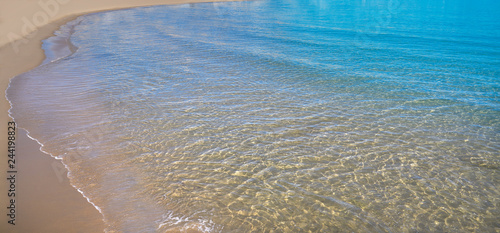 Clear beach water sand in Costa Blanca