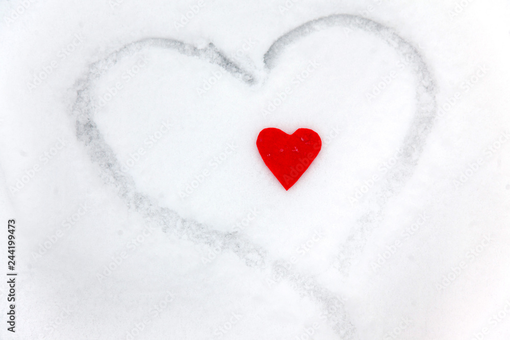 Red heart on the snow white background