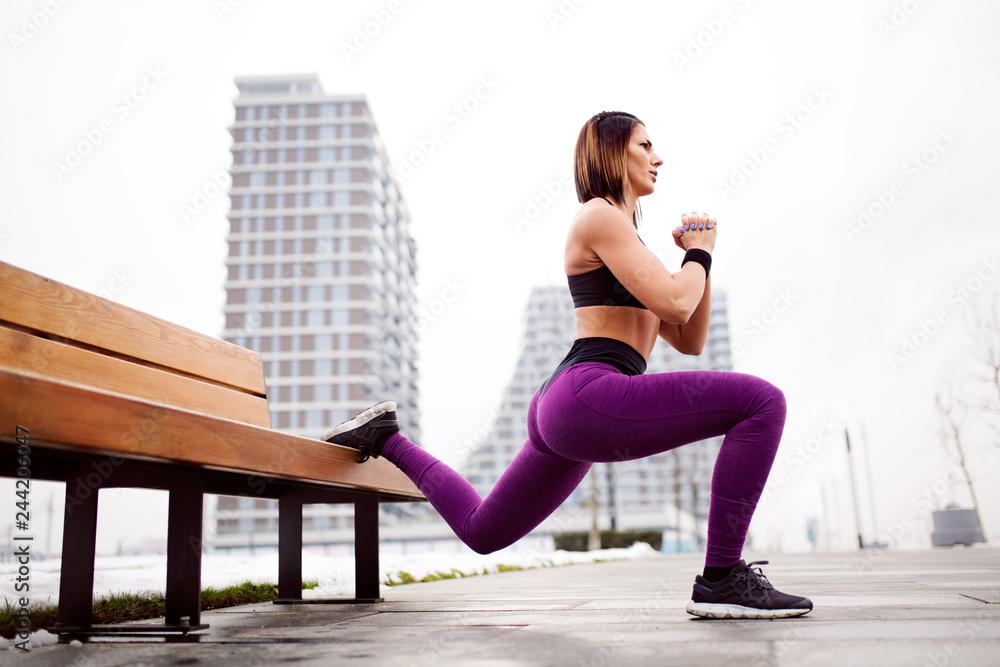 Fitness woman split squat exercise outdoor
