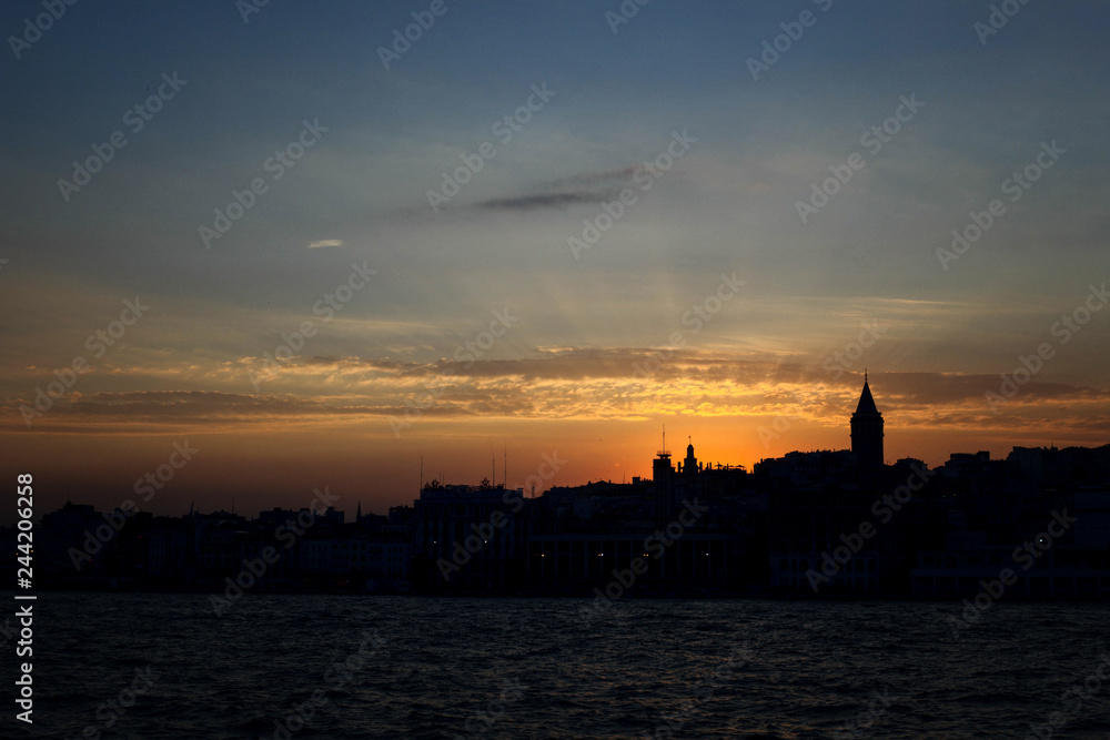 Galata Tower and panorama of Istanbul during the sunset. View from the Bosporus Strait