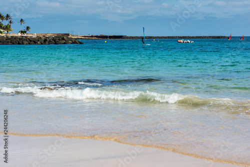 View of Playa de las Cucharas beach in Costa Teguise  Lanzarote  Spain  clear turquoise waters  selective focus