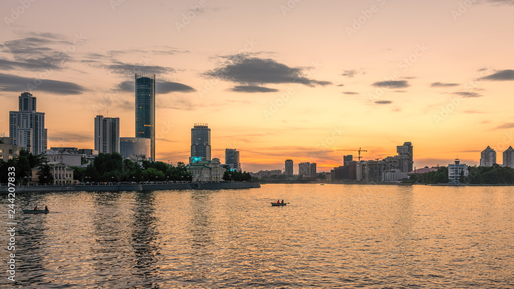 Sunset on a pond in the center of the city