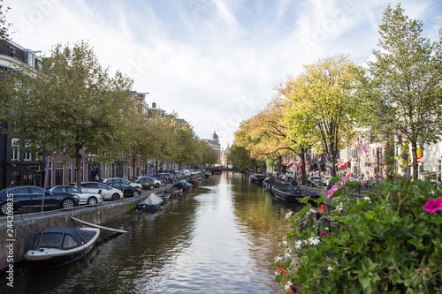 Typical view of canal embankment in historic center of city, Amsterdam, Netherlands.