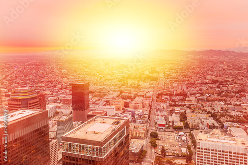 Aerial view of Los Angeles skyline at top view of Oue Skyspace in California, United States with Hollywood Hills on background. Downtown of LA cityscape from observation deck on 70th floor. Sunlight. photo