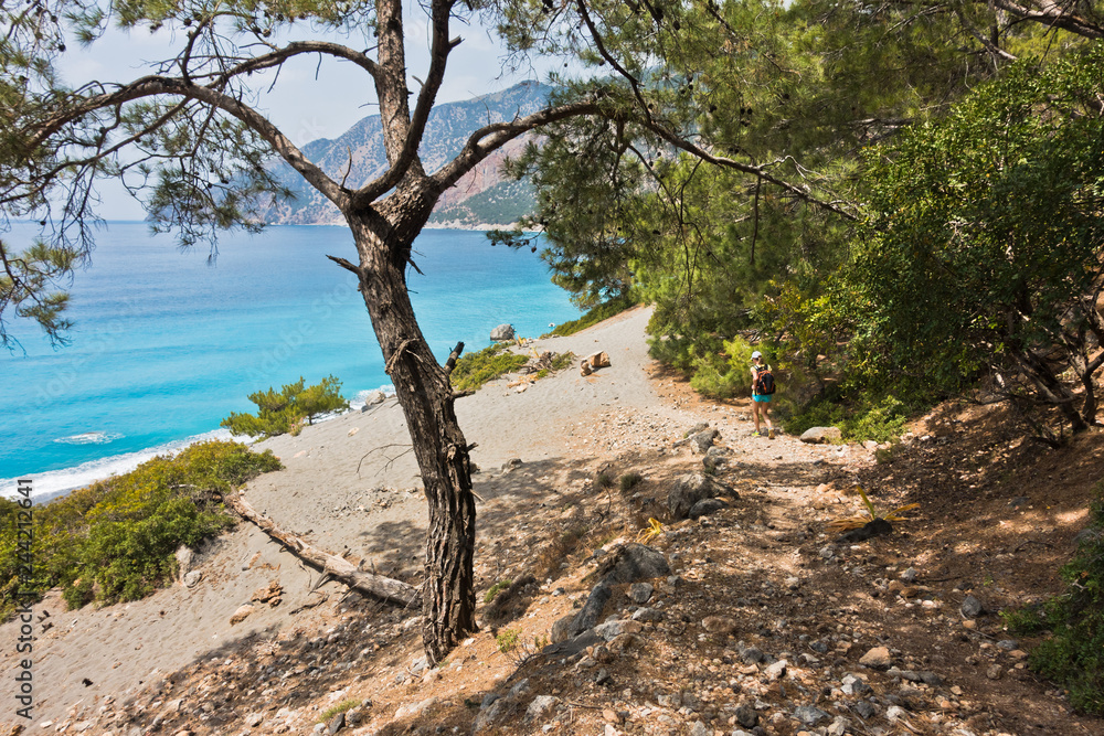 Downhill to sand dunes of Agios Pavlos beach from e4 trail between Loutro and Agia Roumeli at south-west of Crete island, Greece