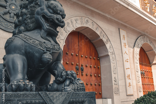 Lion statue in front of the Jing An Temple in Shanghai China