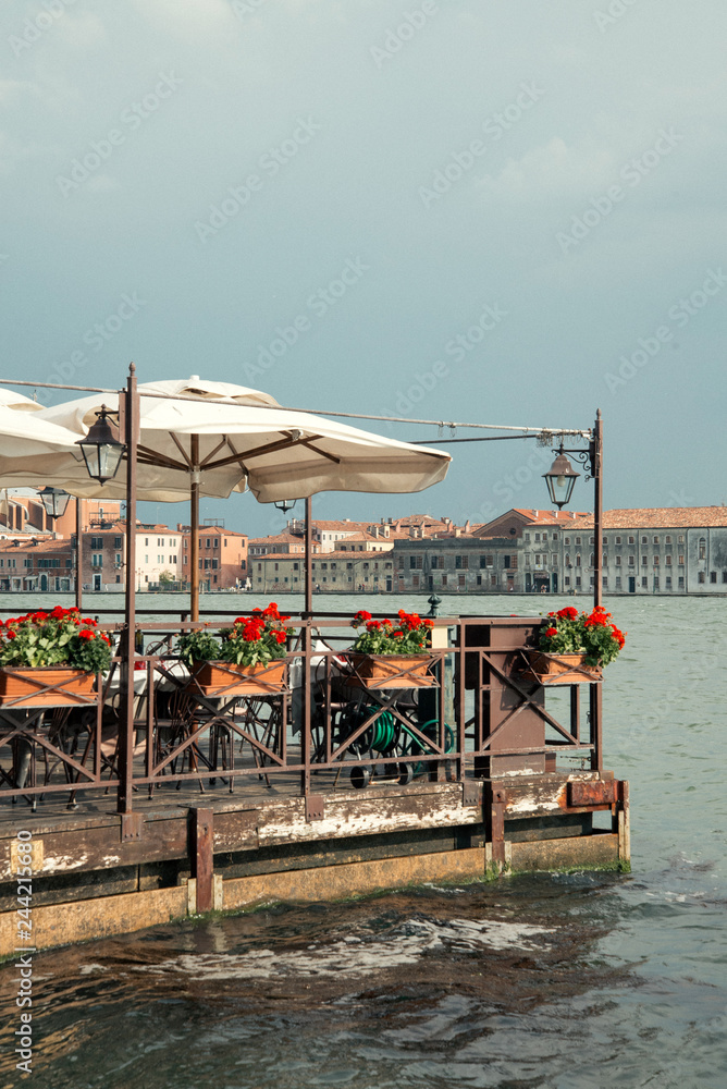 View of Venice. Summer cafe in lagoon 