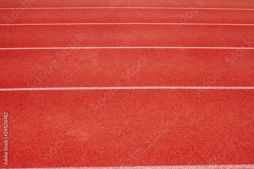 Red running track Synthetic rubber on the athletic stadium. © Fotoglee