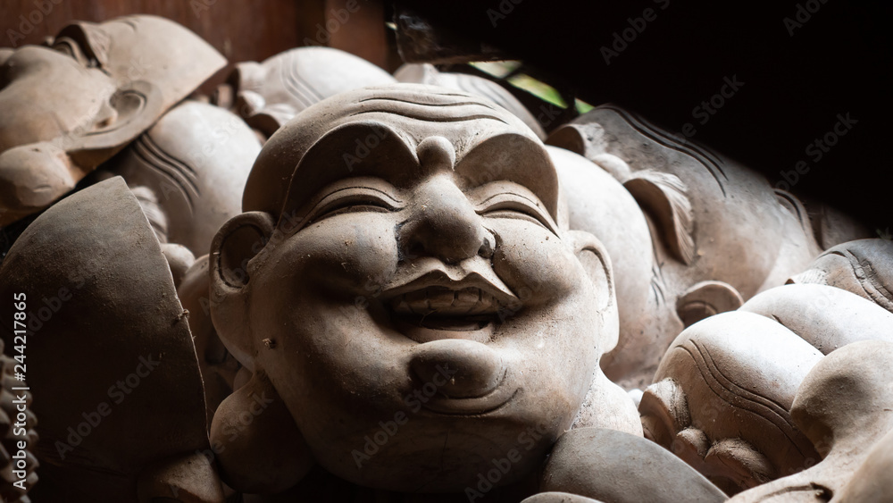 Face mask souvenirs, Hindu and Buddhist wooden carving. souvenir shop selling souvenirs and handicrafts of Bali at famous Ubud Market, Indonesia