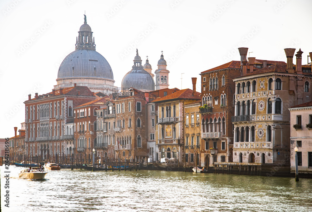 Italy beauty, cathedral Santa Maria della Salute and boat on Grand canal in Venice, Venezia