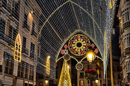 Christmas street decorations in Malaga, Andalucia, Spain. New Year and Christmas lights decorations on the main pedestrian street in the city centre of Malaga. photo