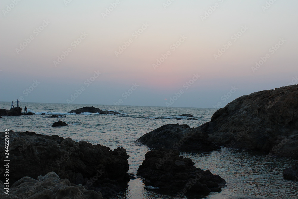 sunset on coast of sea