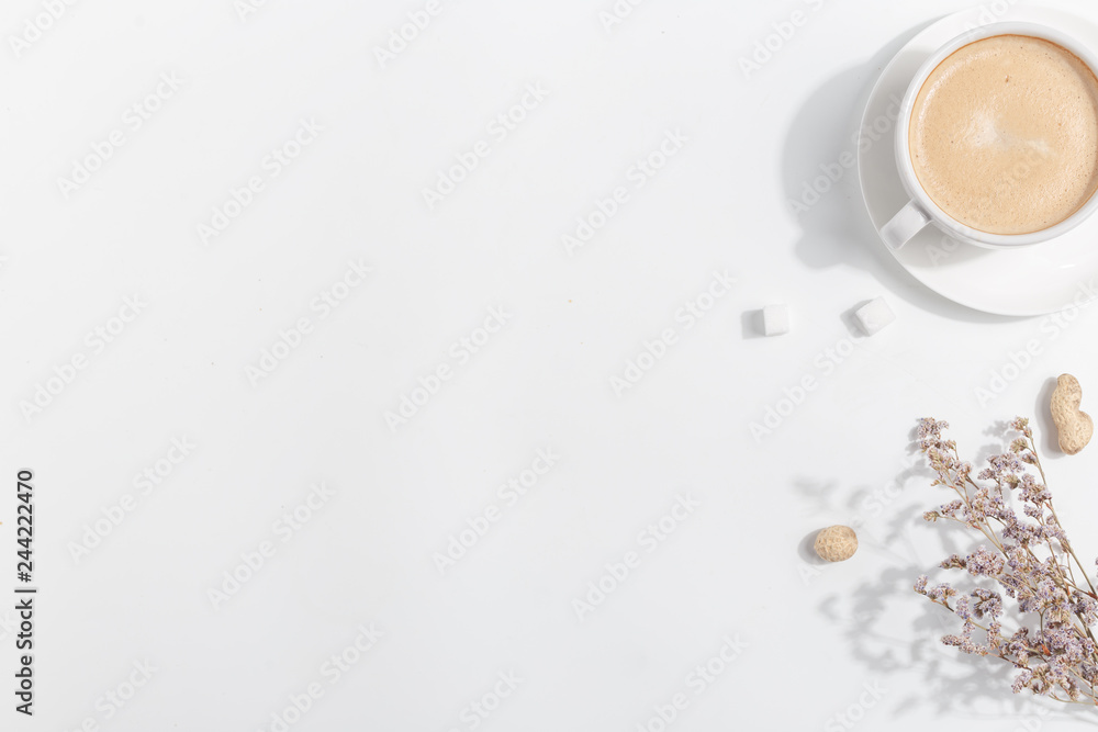 A cup of coffee with milk on a light background. Top view. Copy space. A cup of coffee with milk on a light background. Top view. Copy space.
