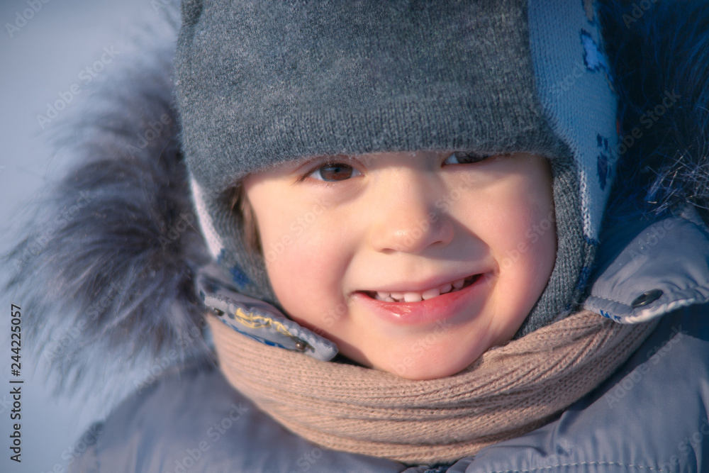 Closeup portrait of happy child in winter hat Closeup portrait of happy child in winter hat
