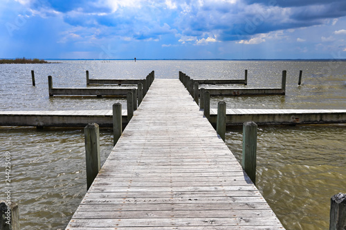 Fototapeta Naklejka Na Ścianę i Meble -  This pier in Corolla in the Outer Banks, North Carolina offers  a spectacular view of the sound in Heritage Park in Currituck.