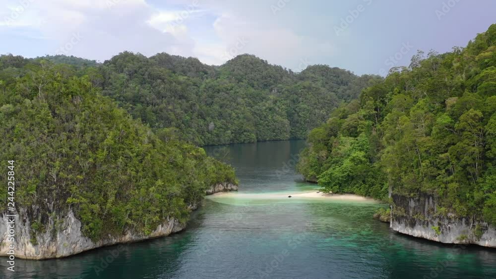 Aerial View of Limestone Islands and Beach in Alyui Bay, Raja Ampat Aerial View of Limestone Islands and Beach in Alyui Bay, Raja Ampat