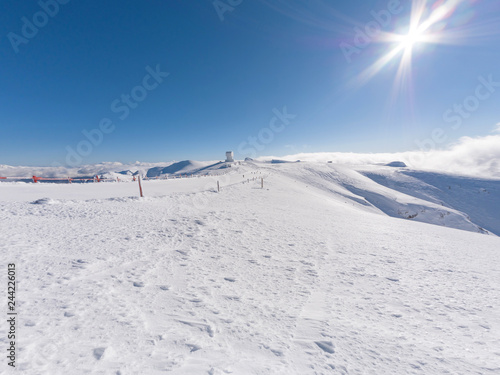 Landscape on the summit of mountain helmos with snow