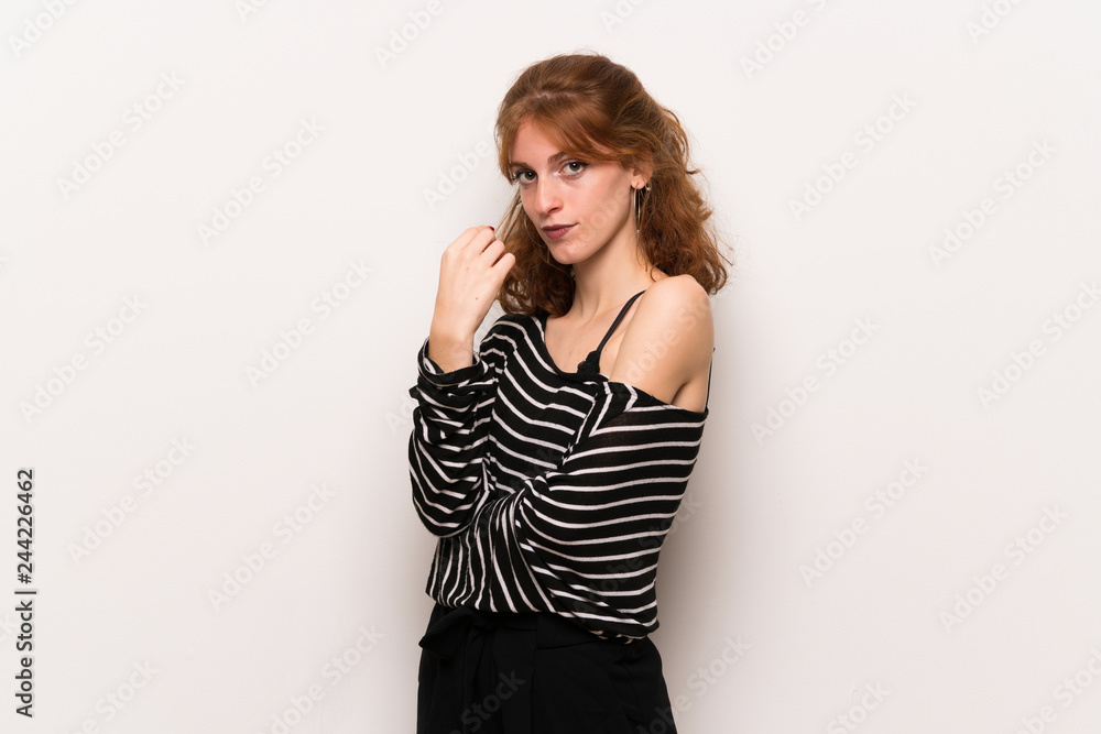 Young redhead woman over white wall With happy expression Young redhead woman over white wall With happy expression
