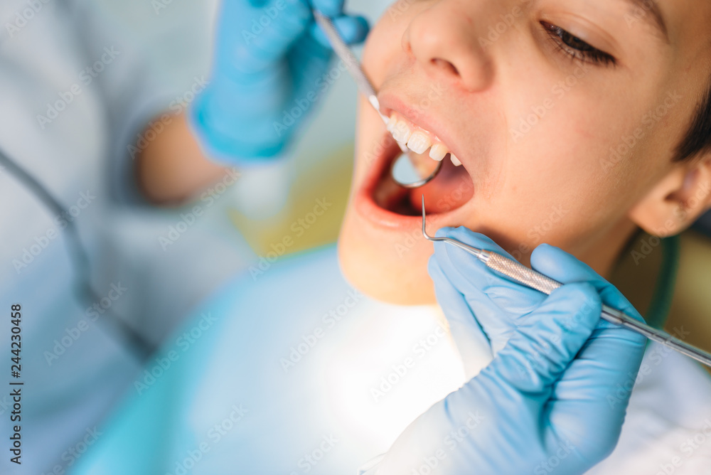 Little boy with open mouth in a dental cabinet Little boy with open mouth in a dental cabinet