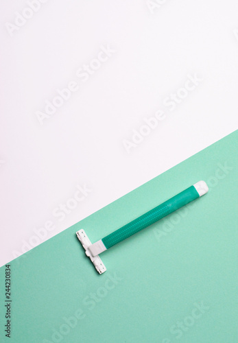 Razor on Green and White Background, Minimal Style Concept, Top View