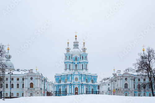 Russia, Saint-Petersburg. Smolny Cathedral in winter day. It's snowing, snowflakes in the sky