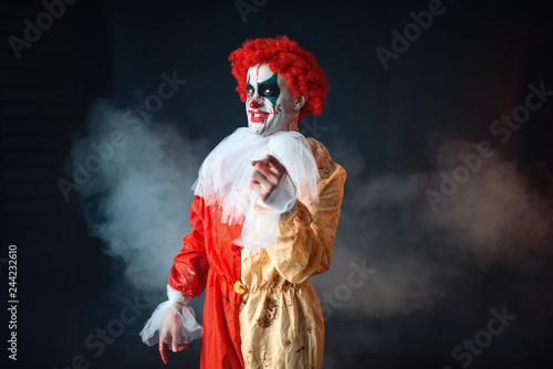 Mad bloody clown pointing at you, terrible sign