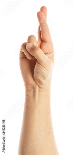Man hand showing crossed fingers lie symbol isolated on white. Alpha
