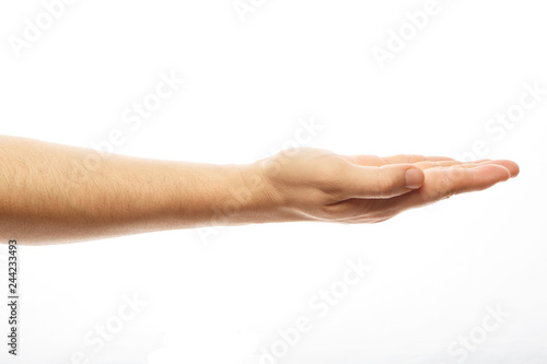 A person's hand holds an invisible object. Empty man's hand, palm up on an isolated white background. Man hand isolated on white background, hold, grab or catch. Palm up. Alpha