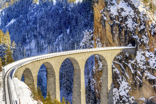 Landwasser Viaduct, which ia a wonder of Swiss mountain railway engineering in 1901 and a unesco heritage since 2008.