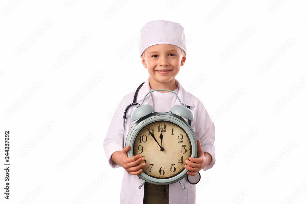 A little, smiling boy doctor in medical uniform, isolated on white, with stethoscope on the neck, reminds you about health care and healthy lifestyle. Waist up portrait, looking at camera. A little, smiling boy doctor in medical uniform, isolated on white, with stethoscope on the neck, reminds you about health care and healthy lifestyle. Waist up portrait, looking at camera.