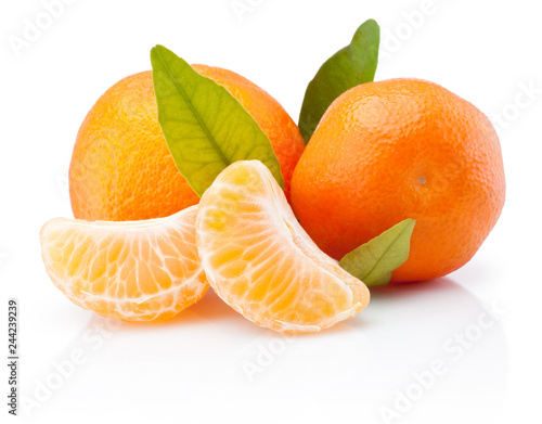 Two tangerines with leaves and peeled pieces isolated on white background