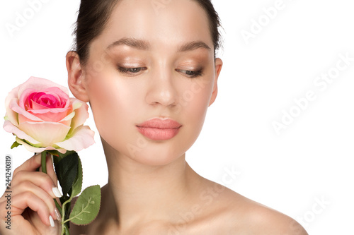 Beautiful young woman with clean perfect skin. Beauty portrait. Spa  skin care and wellness. White flowers