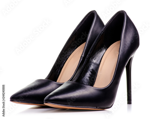 Female black leather high heels shoes on white background isolation