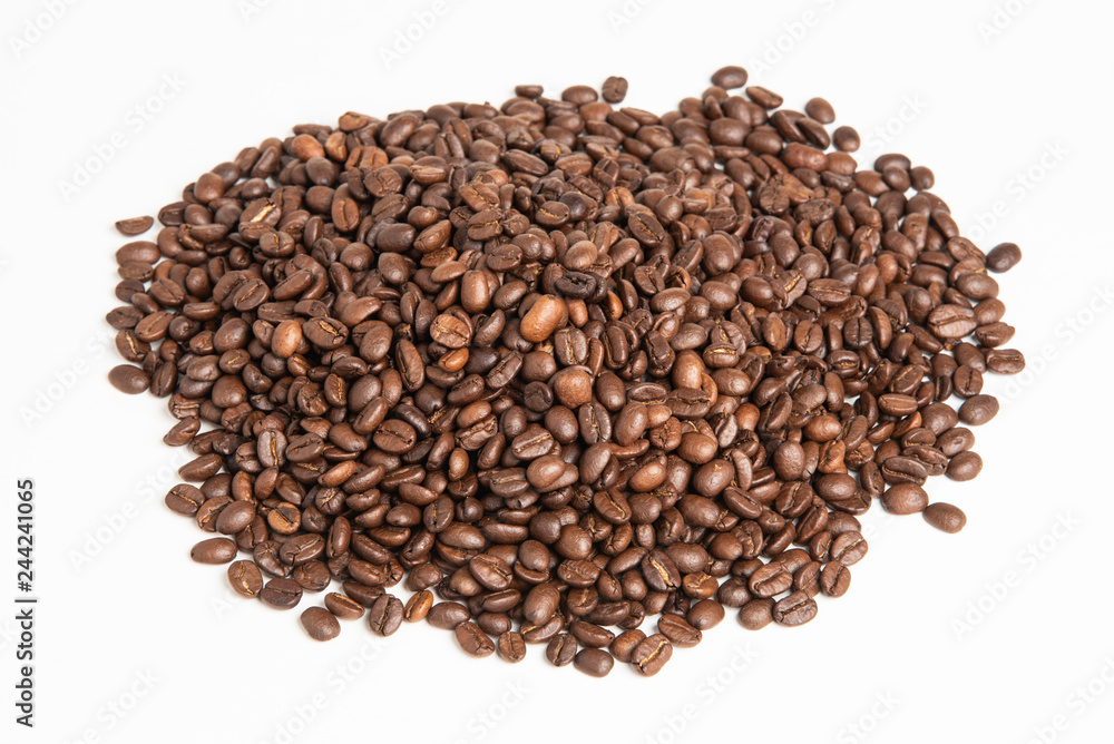 A mound of roasted and dried arabica coffee beans set on a white background in a horizontal image format. A mound of roasted and dried arabica coffee beans set on a white background in a horizontal image format.