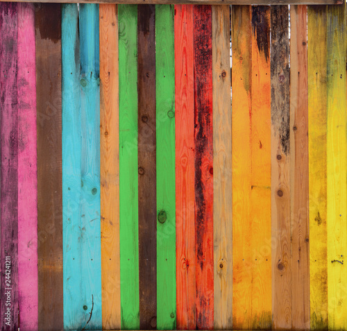 Multicolored wooden background with a wide range of saturated colors. © maykal