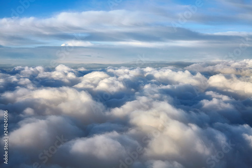 Cloudscape seen through an airplane window © MaciejBledowski