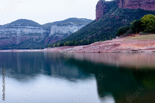 Cliffs of the Sau Reservoir, on a cloudy day (Catalonia, Spain).