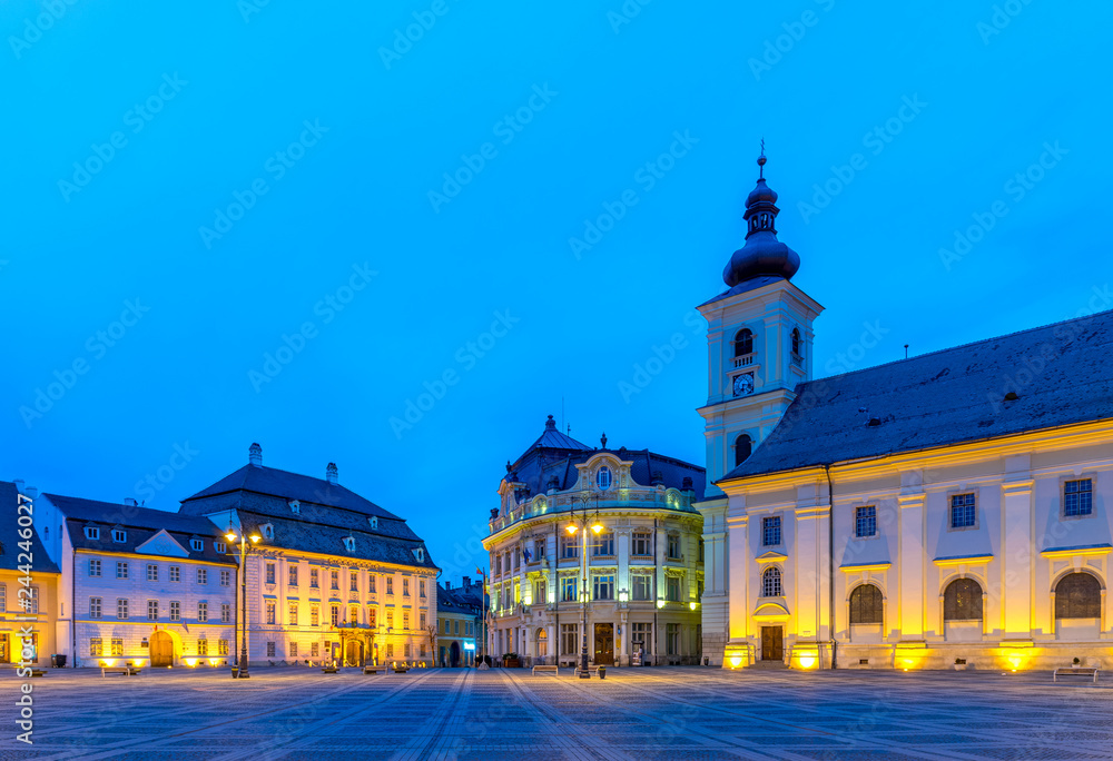 Obraz premium The Big Square with the Citty Hall in Sibiu at sunrise in Transylvania region, Romania