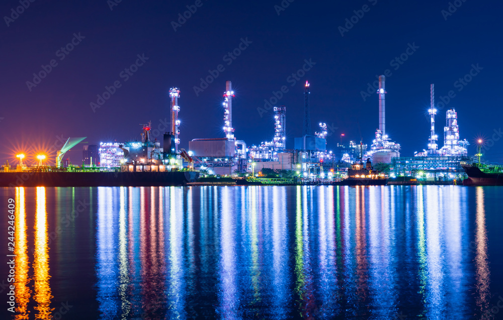 Petroleum refinery industry on night  light which reflect on river