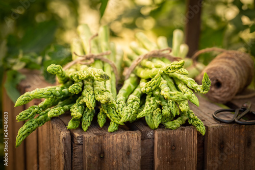 Tasty green asparagus on a wooden box